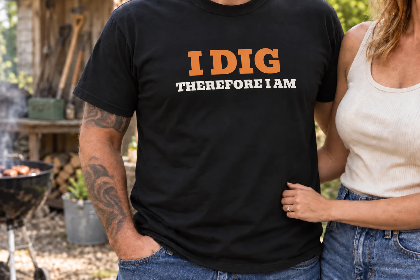 I Dig Therefore I Am T-shirt worn beside a partner at a backyard barbecue