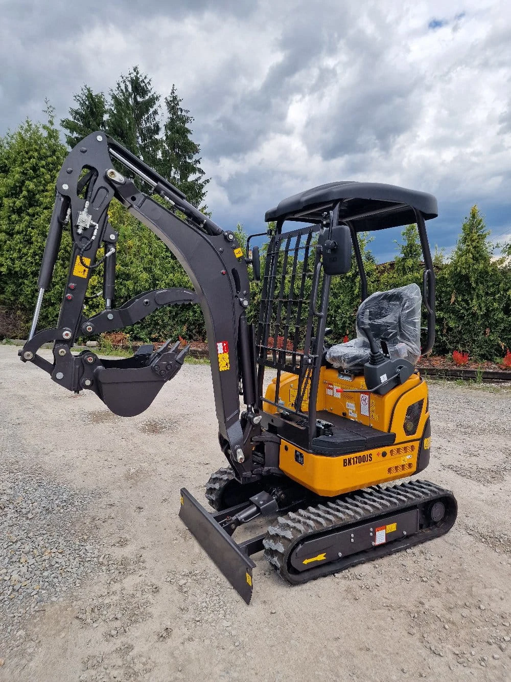 Yellow and black Berger Kraus BK1700JS mini excavator, three-quarter view